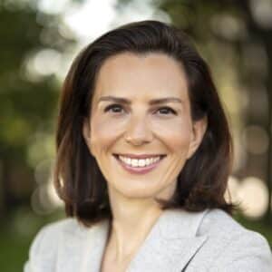 Keren Yarhi-Milo smiling and wearing a light gray blazer